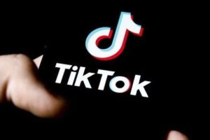 Threatened young woman with tik tok