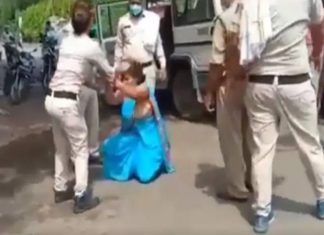 police beats woman