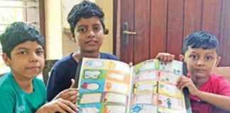 Vaccine Challenge; Three students make name slips to raise money