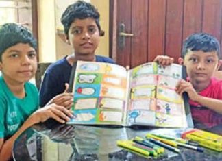 Vaccine Challenge; Three students make name slips to raise money