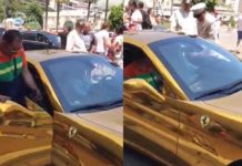Young man with gold-plated car