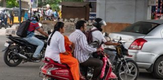 children in two wheeler vehicle